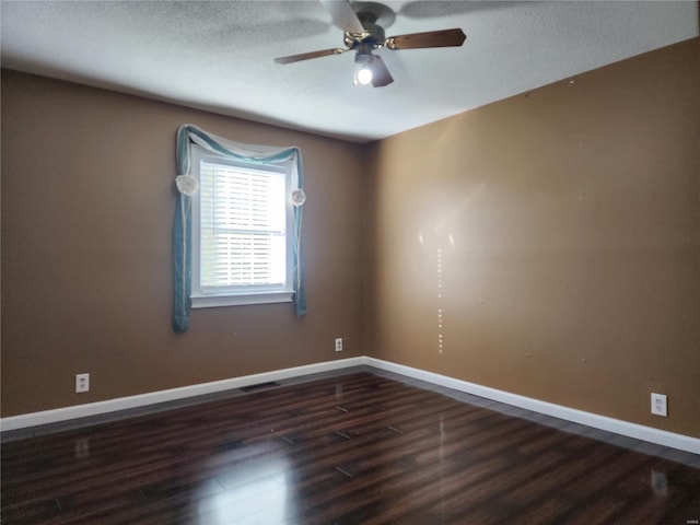 unfurnished room with a textured ceiling, ceiling fan, and dark hardwood / wood-style floors