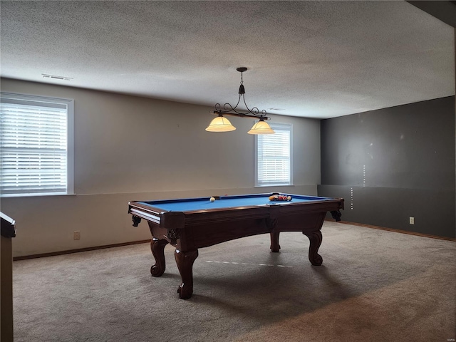 game room with carpet flooring, a wealth of natural light, a textured ceiling, and pool table