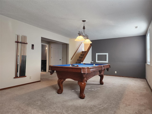 recreation room with light carpet, a textured ceiling, and billiards