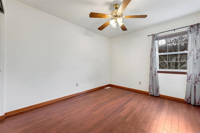 unfurnished room with wood-type flooring and ceiling fan