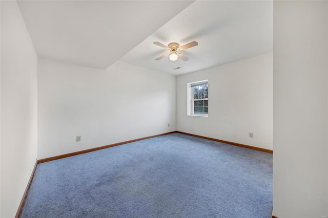 empty room featuring ceiling fan and carpet floors