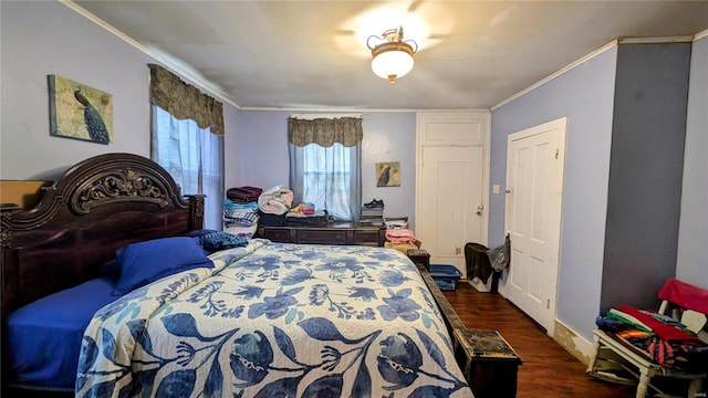 bedroom featuring ornamental molding and dark hardwood / wood-style floors