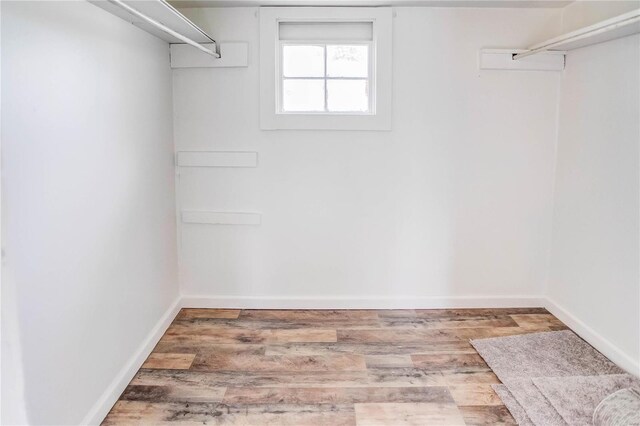 walk in closet featuring hardwood / wood-style floors