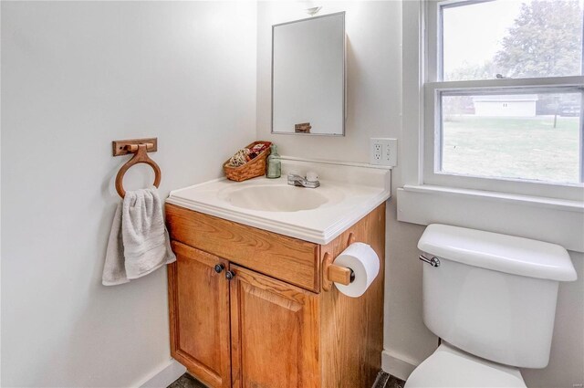 bathroom with toilet and vanity