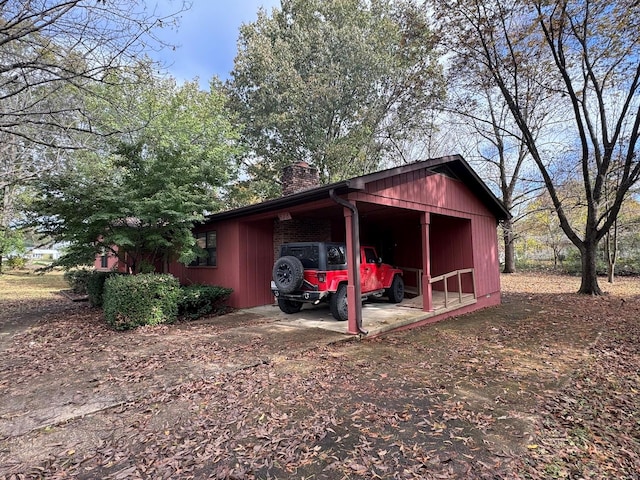 view of outbuilding featuring a carport