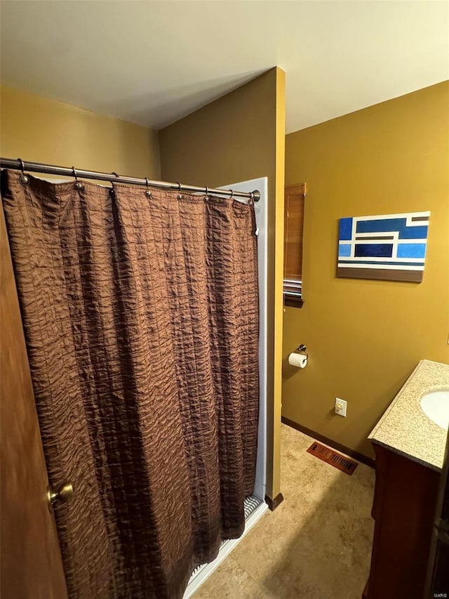 bathroom with vanity and a shower with shower curtain