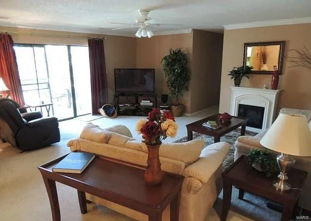 living room with light carpet, ceiling fan, and ornamental molding