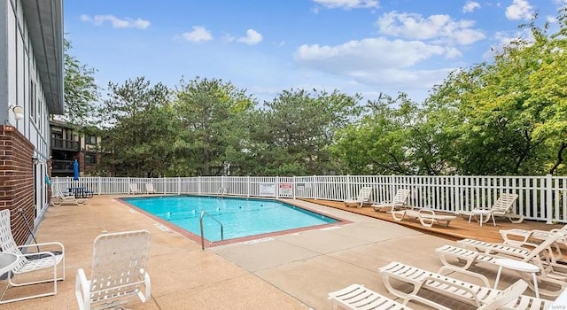 view of swimming pool featuring a patio area