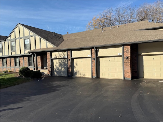 view of side of property with a garage