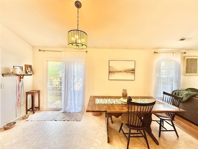 dining room featuring a chandelier