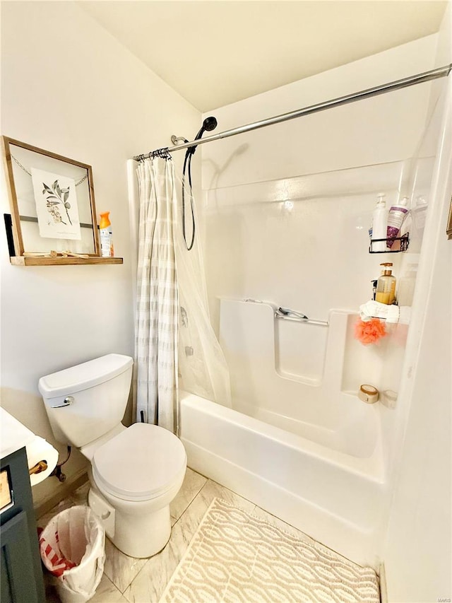 bathroom with shower / bath combo with shower curtain, tile patterned floors, and toilet