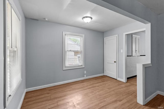 spare room featuring light wood-type flooring