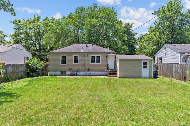 back of property featuring a lawn