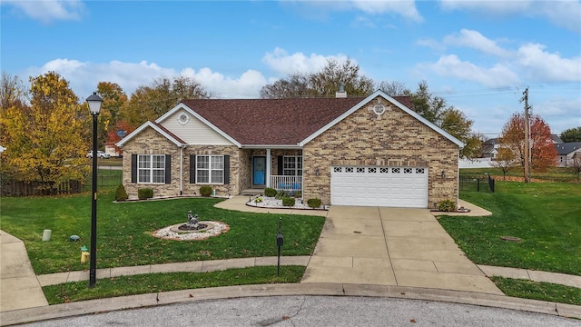 view of front of property with a front yard and a garage