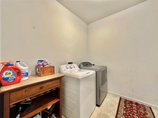 washroom featuring washer and dryer