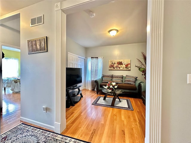 living room with hardwood / wood-style floors and a wealth of natural light