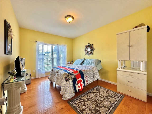 bedroom with light hardwood / wood-style flooring