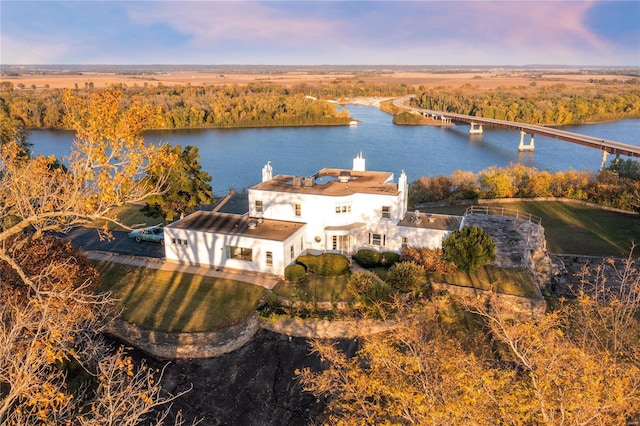 aerial view at dusk with a water view