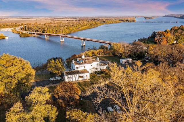 aerial view at dusk with a water view