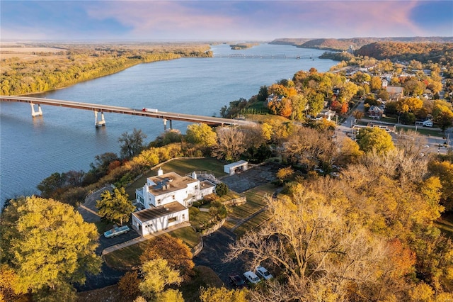 aerial view at dusk with a water view