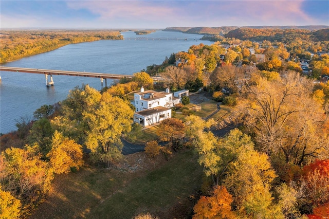 aerial view at dusk with a water view