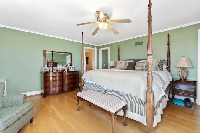 bedroom featuring ceiling fan, hardwood / wood-style floors, and crown molding