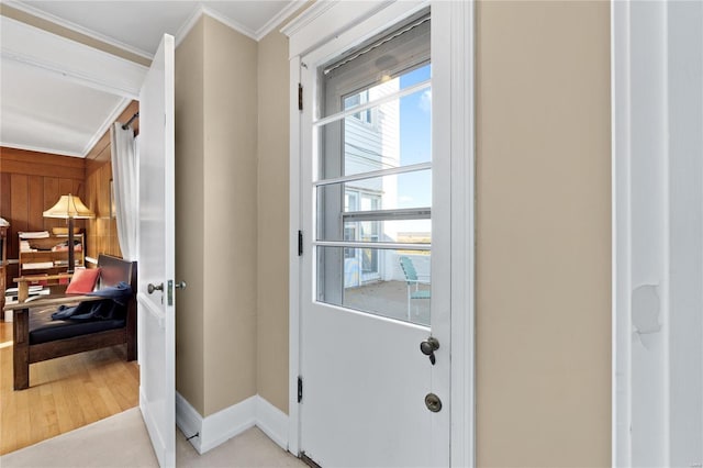 entryway featuring light hardwood / wood-style flooring and ornamental molding