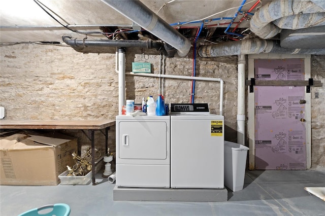 clothes washing area featuring washer and clothes dryer