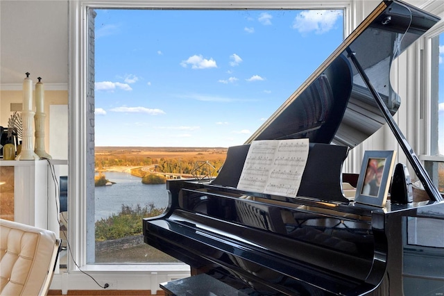 miscellaneous room with a water view and crown molding