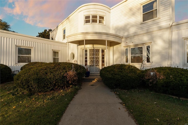 view of exterior entry at dusk