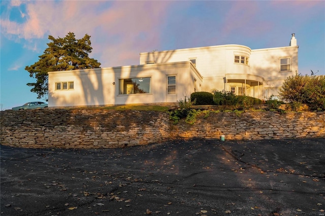 view of property exterior at dusk