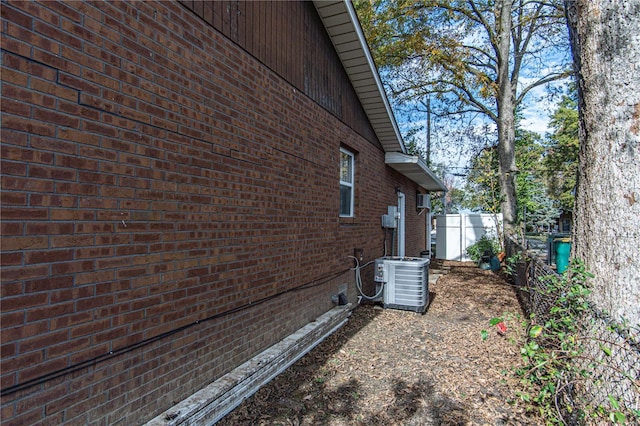 view of side of property with central AC