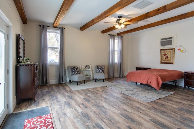 bedroom featuring beam ceiling, a wall mounted AC, ceiling fan, and dark wood-type flooring