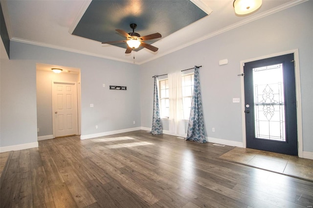 entryway with ceiling fan, crown molding, and dark hardwood / wood-style flooring