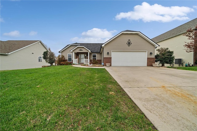 ranch-style home with a garage and a front lawn