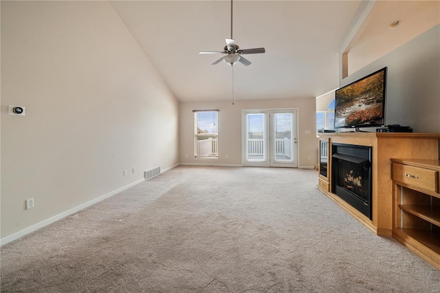 living room with light carpet, high vaulted ceiling, and ceiling fan