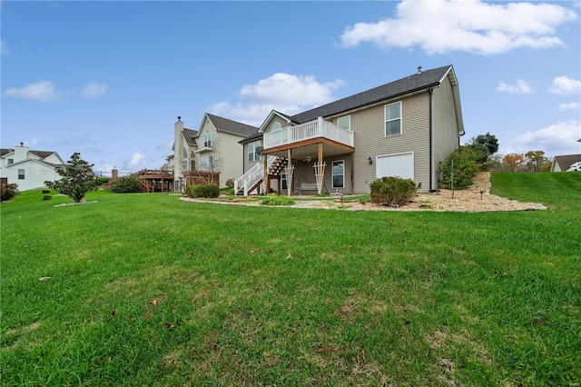 back of property featuring a yard and a wooden deck