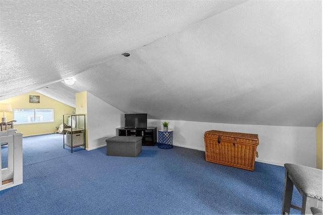 bonus room featuring carpet floors, lofted ceiling, and a textured ceiling