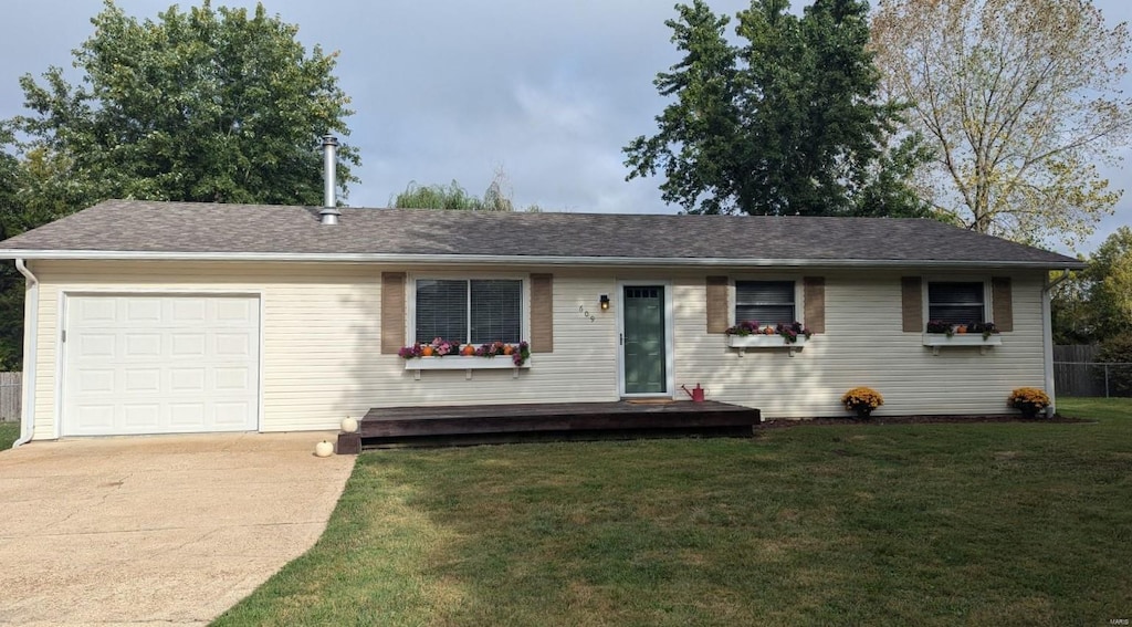 ranch-style house featuring a front lawn, a garage, and a deck