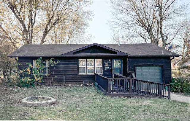 ranch-style home featuring a garage and a front yard