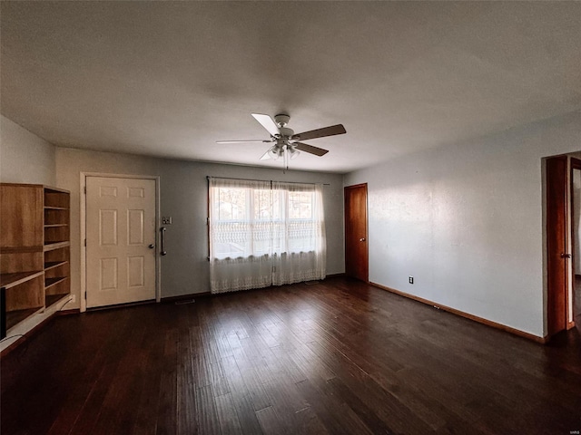 foyer entrance with dark wood-type flooring and ceiling fan