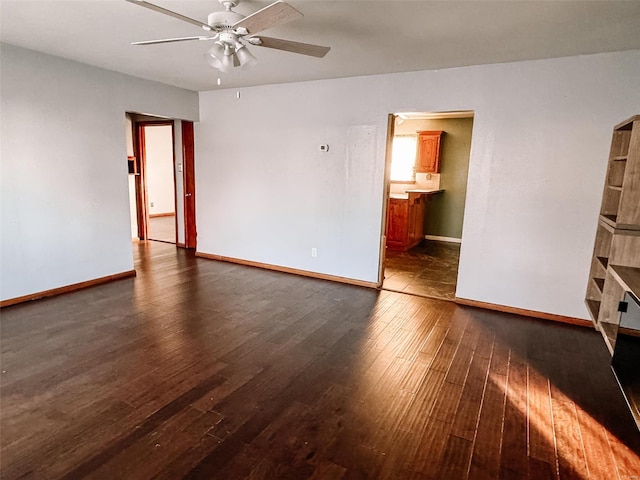 unfurnished room featuring dark hardwood / wood-style floors and ceiling fan