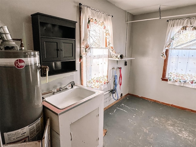 bathroom featuring water heater and concrete floors