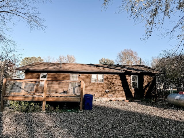 view of home's exterior featuring a wooden deck