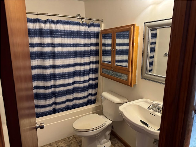 full bathroom with shower / bath combo, tile patterned flooring, sink, and toilet