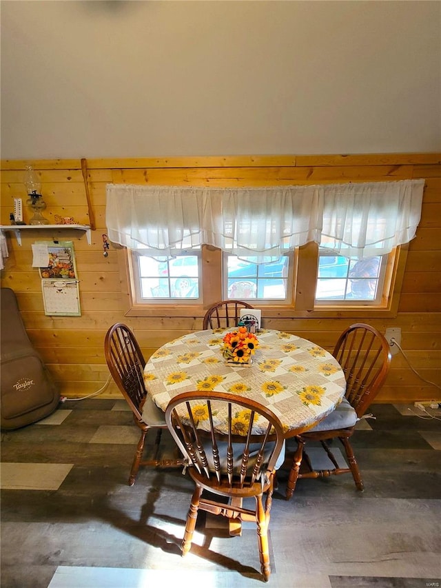 dining space with wooden walls