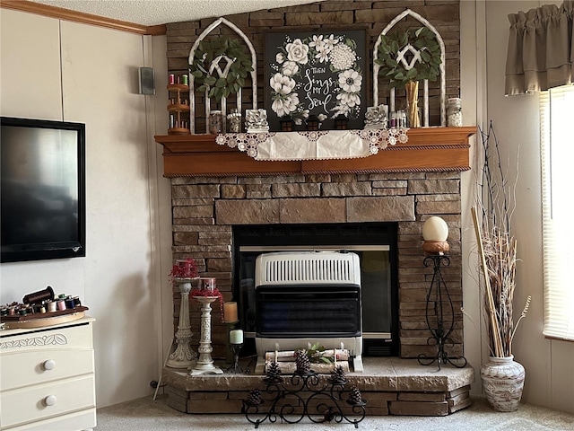 interior details featuring heating unit, a fireplace, crown molding, a textured ceiling, and carpet flooring