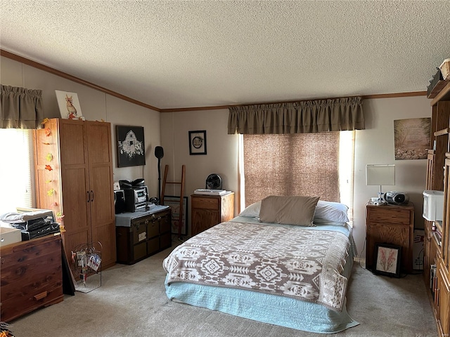 bedroom with light colored carpet, a textured ceiling, and ornamental molding