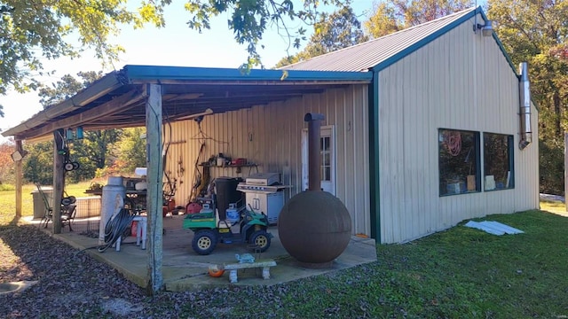 view of outbuilding with a lawn