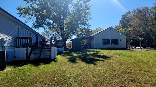 view of yard with a wooden deck